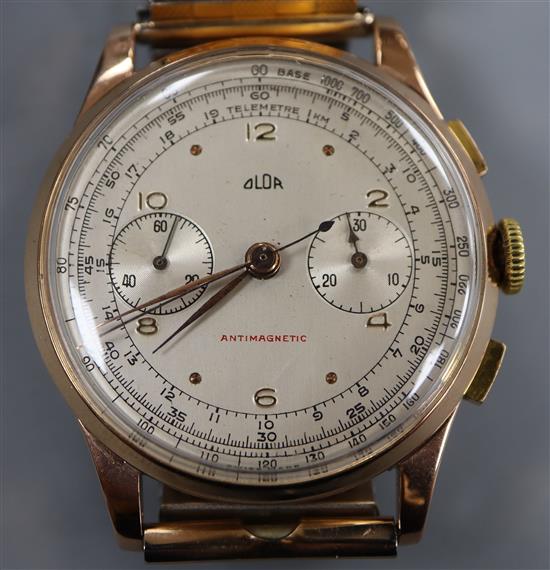 A gentlemans 1950s? 750 yellow metal Swiss Olor chronograph manual wind wrist watch, on associated flexible strap.